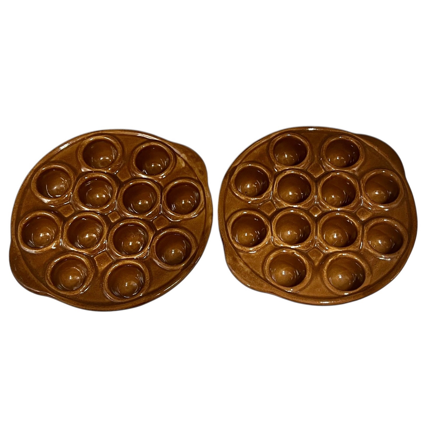 A pair of brown French vintage ceramic escargot plates, each featuring 12 holes and side handles, perfect for French recipes or adding charm to a farmhouse country kitchen, displayed on a white background.
