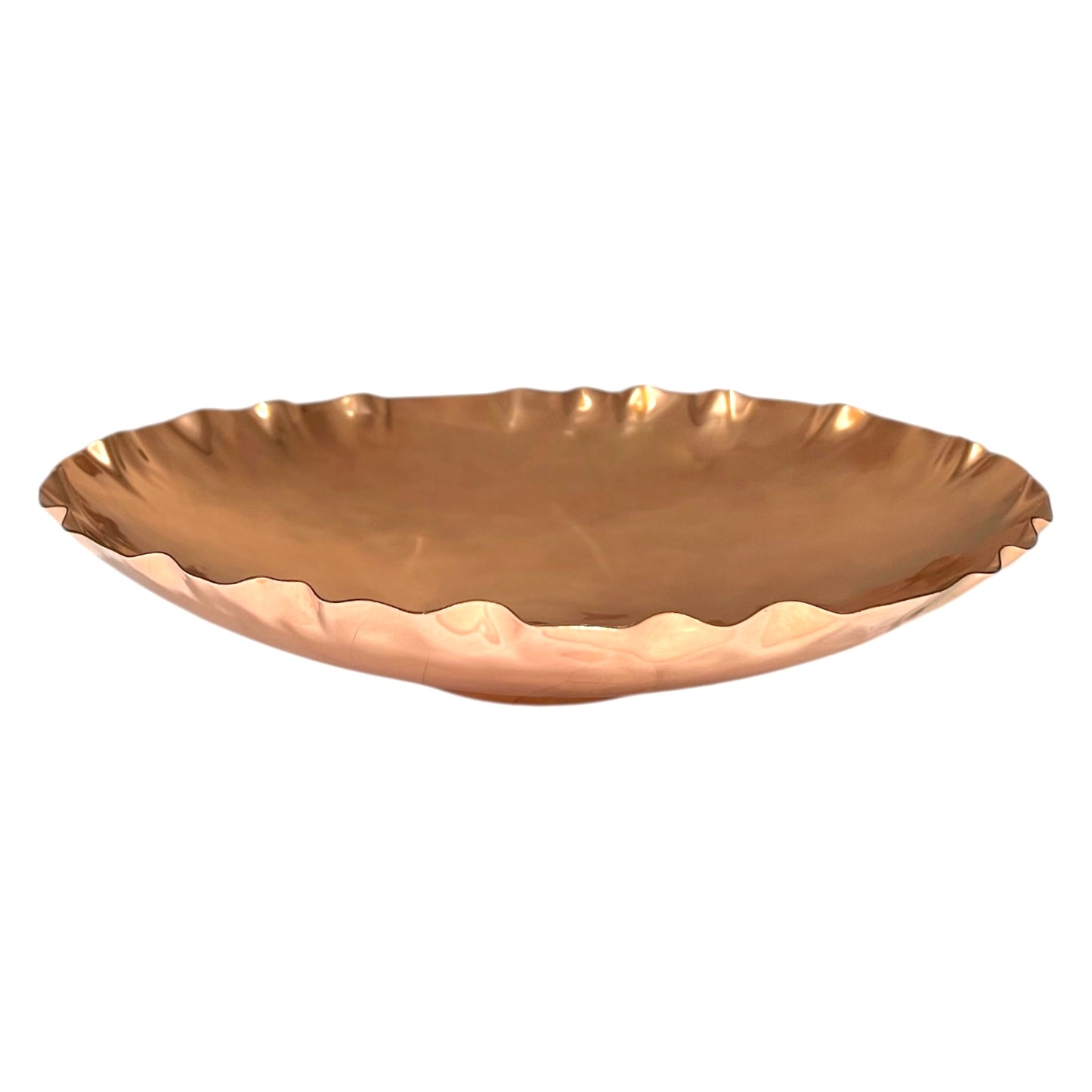Close-up of a copper fruit bowl on a white background