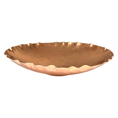 Close-up of a copper fruit bowl on a white background