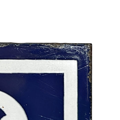 Close up of a French blue and white enamel door number - top right corner