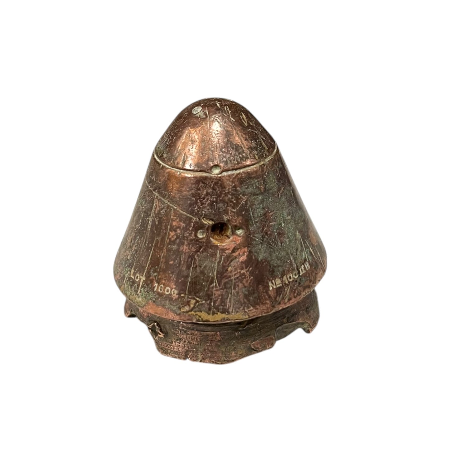 WW1 British brass fuse now repurposed as a paperweight on a white background
