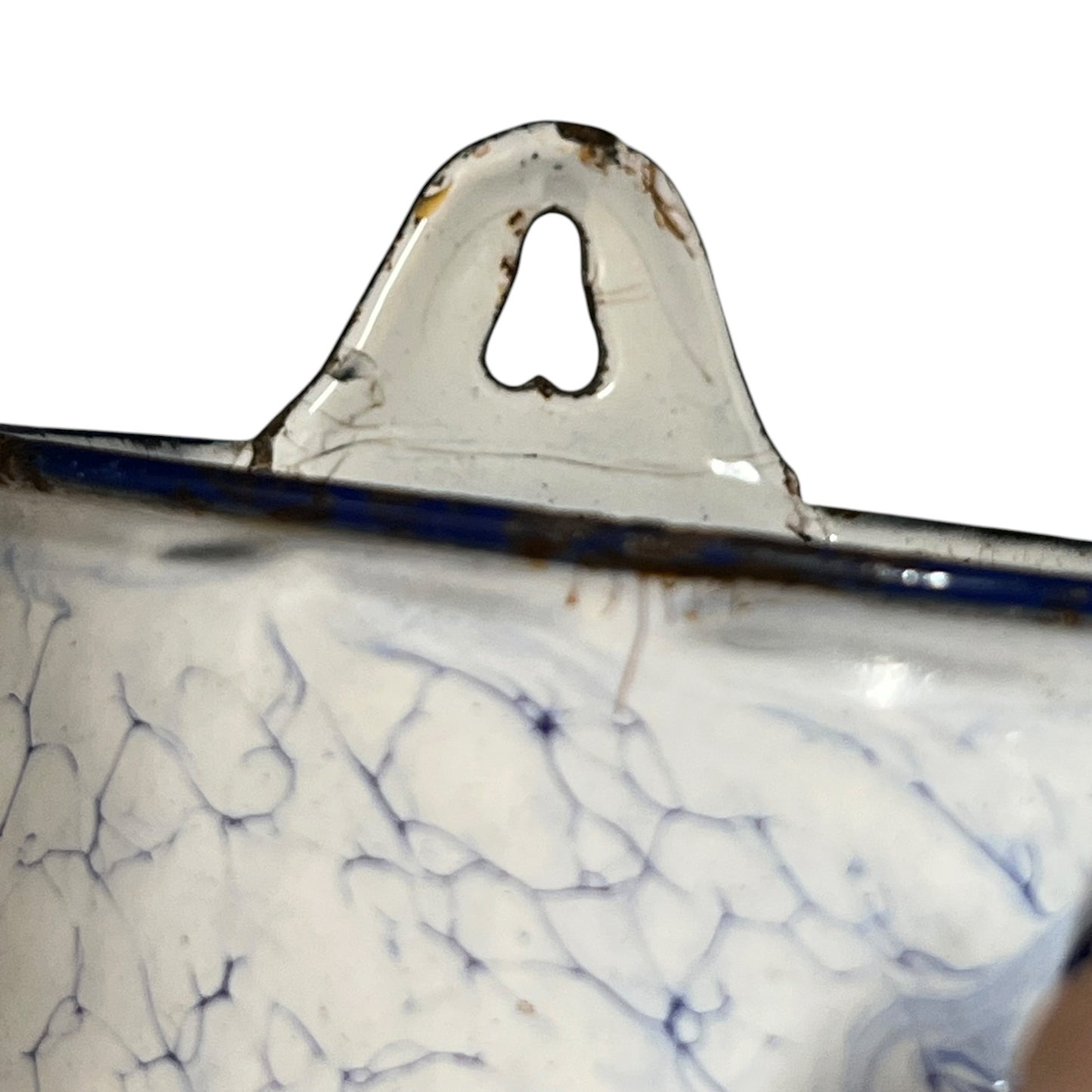 Close up of a French enamel vintage garden wall mounted planter or kitchen bathroom storage pot, on a white background 