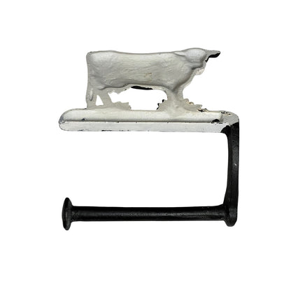 Decorative toilet paper holder with cow design on a white background