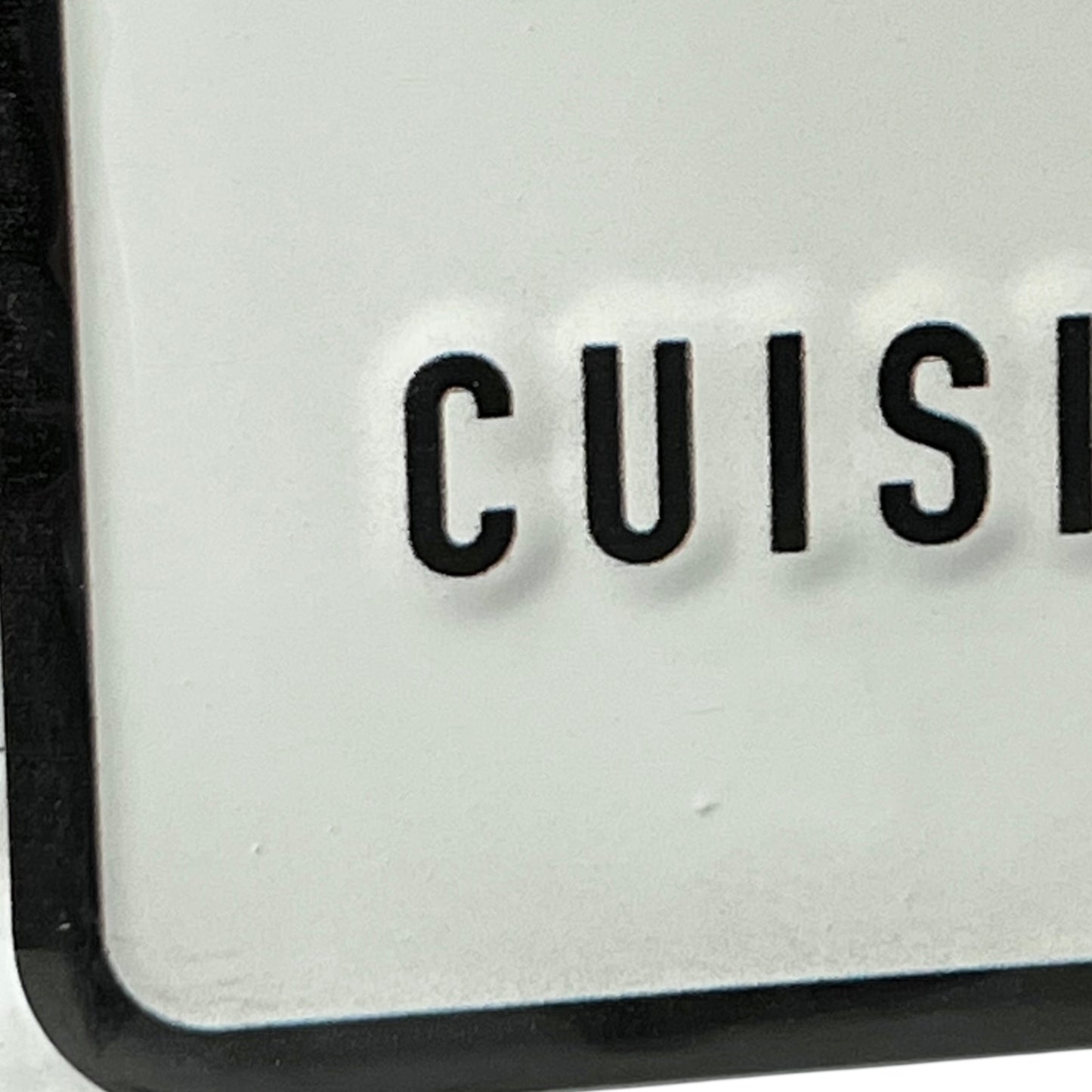 Close-up of a kitchen appliance with 'CUISE' branding on a white background