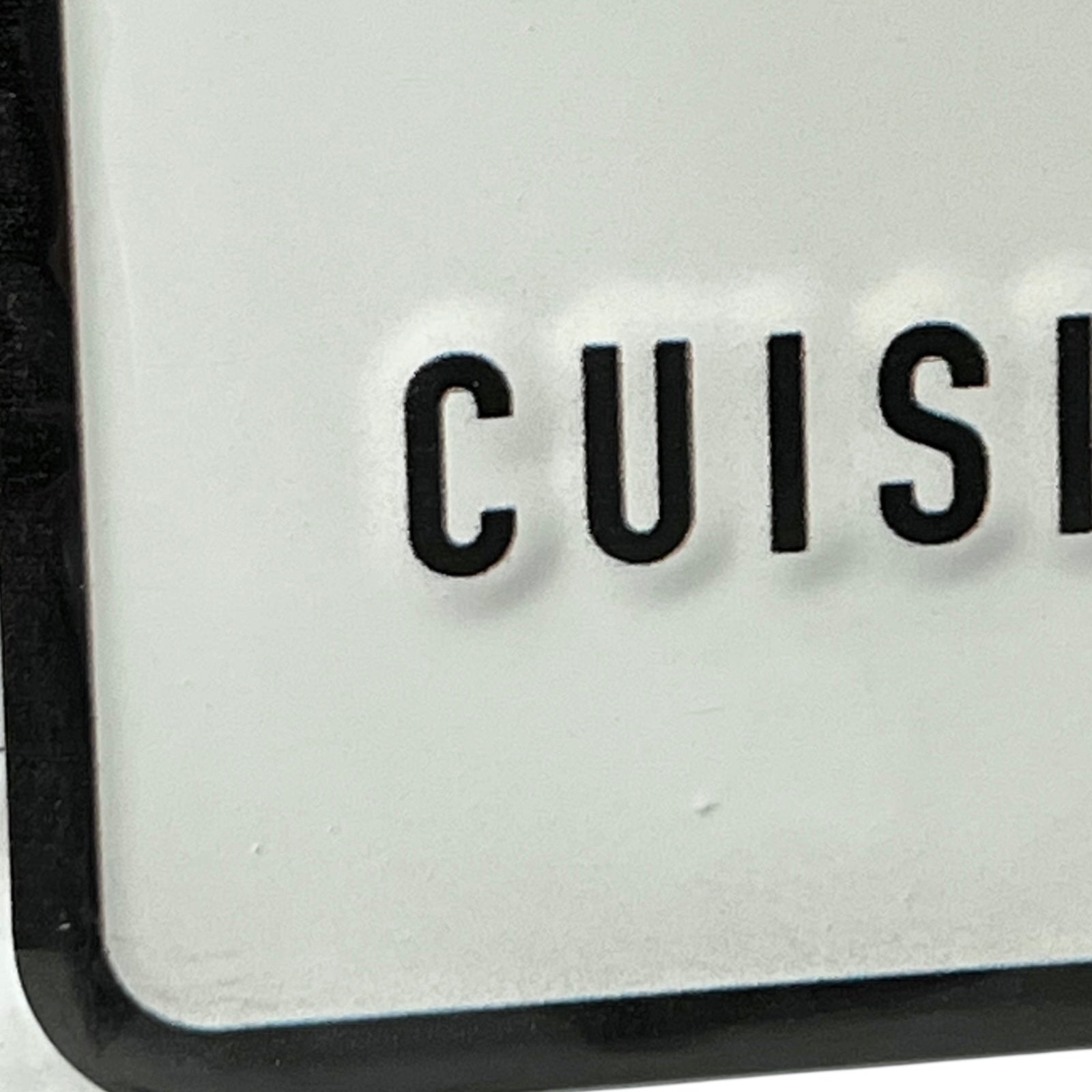 Close-up of a kitchen appliance with 'CUISE' branding on a white background
