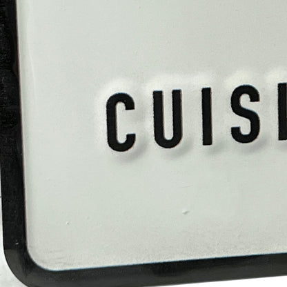 Close-up of a kitchen appliance with 'CUISE' branding on a white background