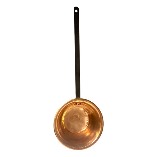 copper ladle pan with a black handle on a white background
