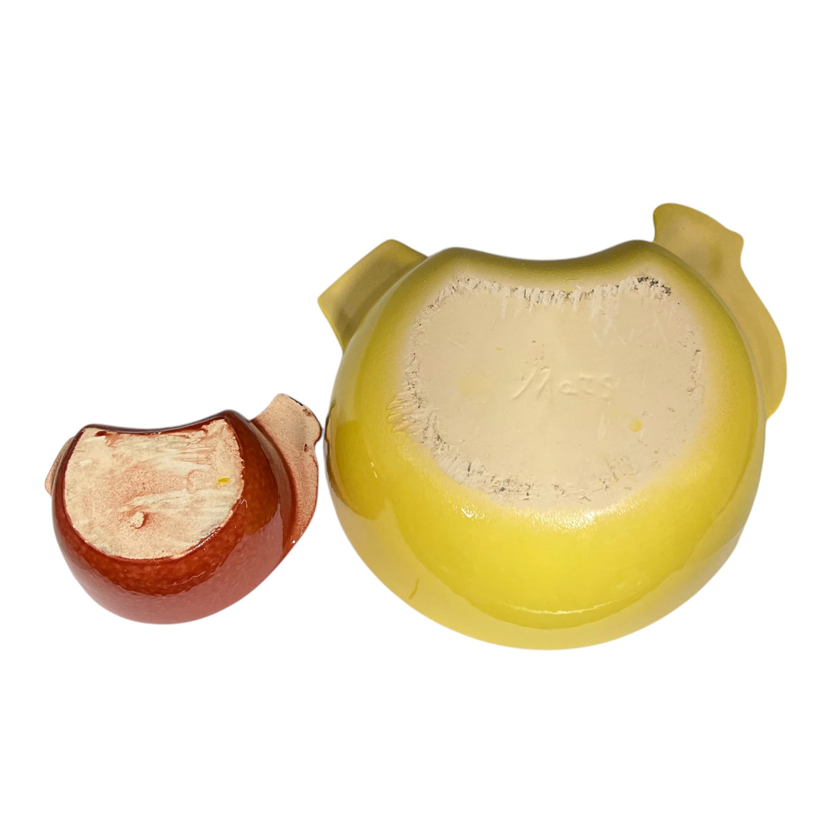 A yellow ceramic bowl with a small matching brown ceramic dish or scoop shown beside it on a plain white background.