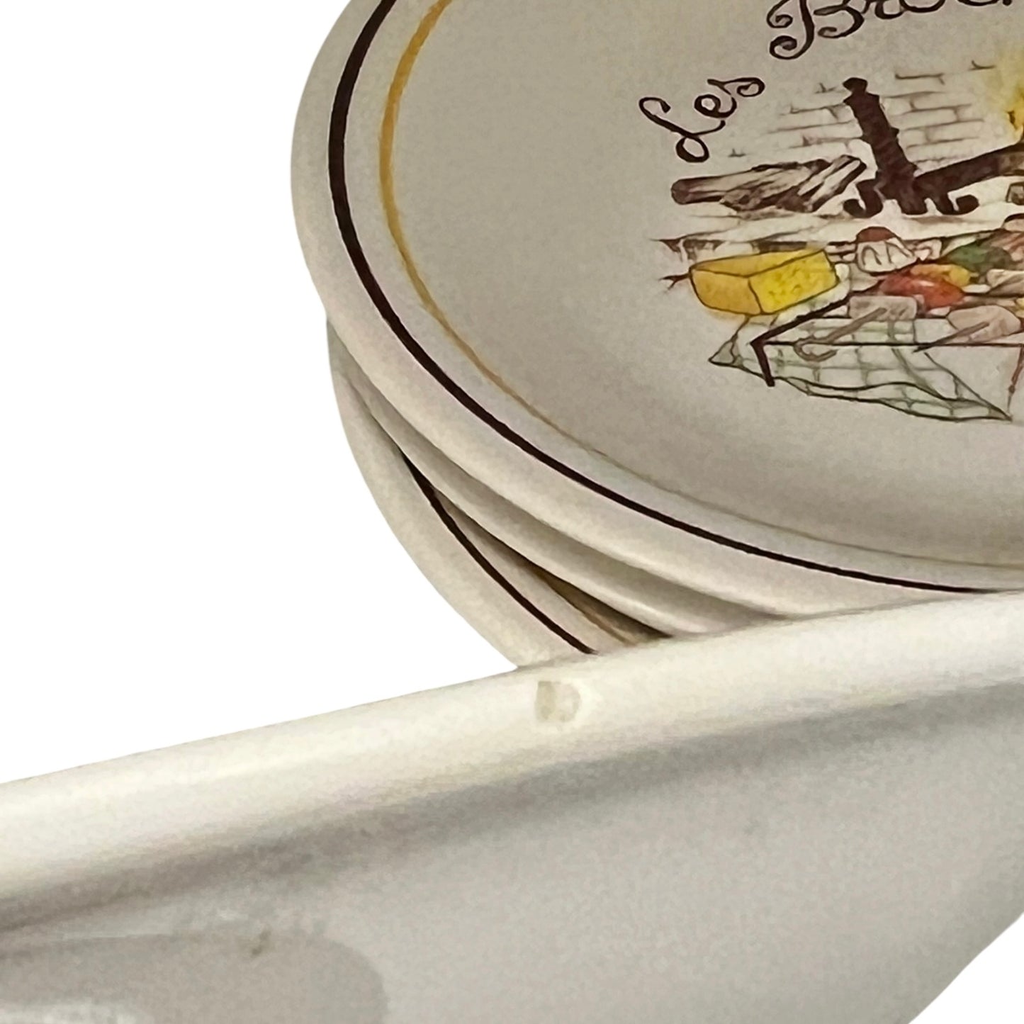 Stack of ceramic plates with artistic design on a white background
