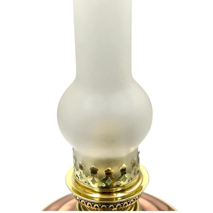 White oil lamp with gold base on a white background