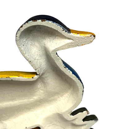 Close up of cast iron doorstop on a white background