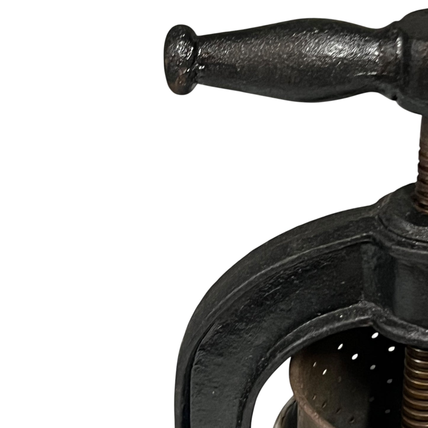 Close-up of a black metal clamp on a white background