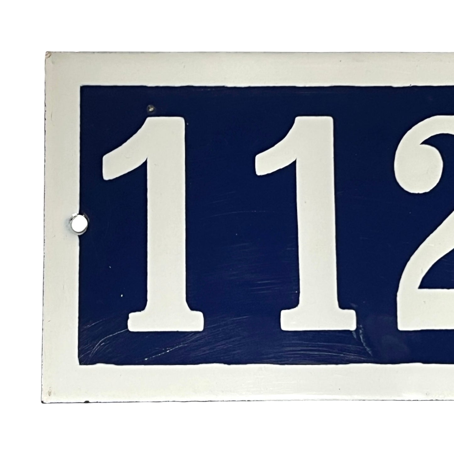 Close up of a French door number on a white background