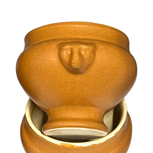 light brown ceramic French soup bowls with lions head handles on a white background 