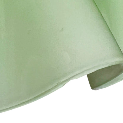 close up of a glass lampshade on a white background