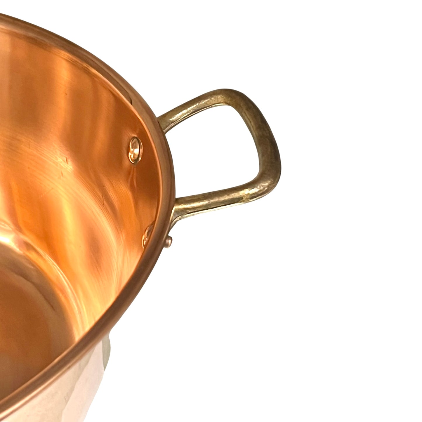 Brass handle of an up cycled copper sink on a white background 