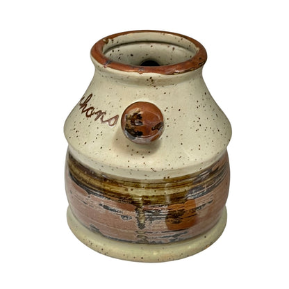 Vintage French cornichon pickle jar with cork lid on a white background