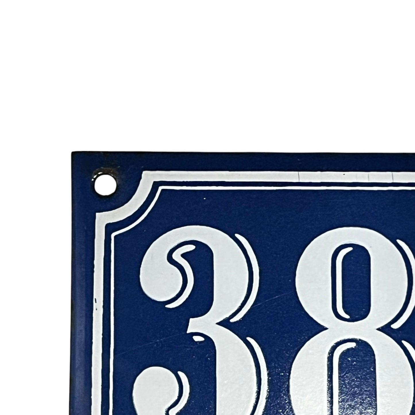Blue metal sign with white number '384'