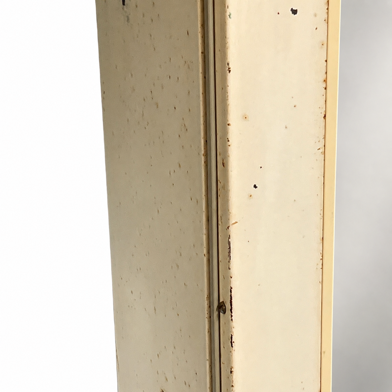 close up of a vintage metal bathroom cabinet