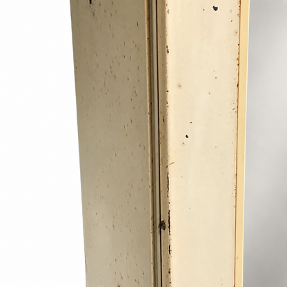 close up of a vintage metal bathroom cabinet