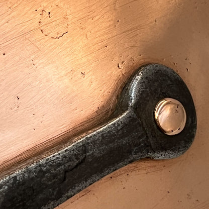 cast iron handle with copper rivets of copper pan lid