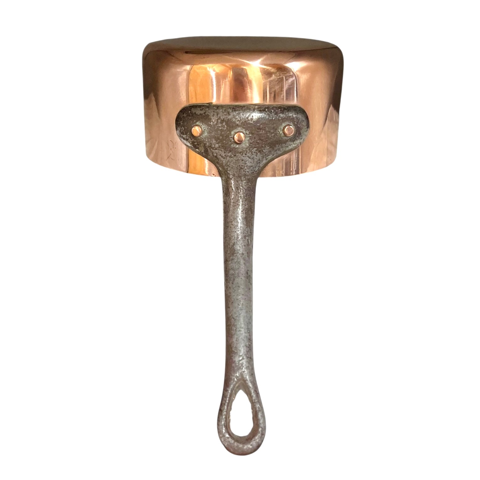 Copper saucepan with a black cast iron handle on a white background