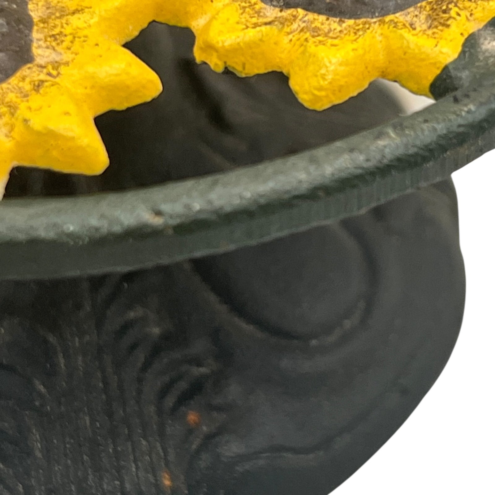 Close-up of a sunflower decoration on a kitchen paper towel stand on a white background