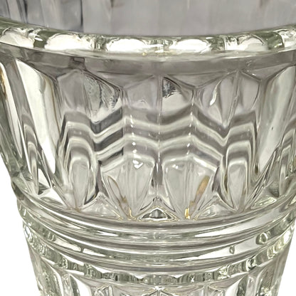 Close-up of a clear glass with diamond cut pattern