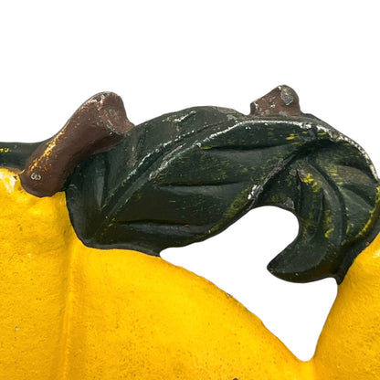 close up of a cast iron kitchen roll holder on a white background 