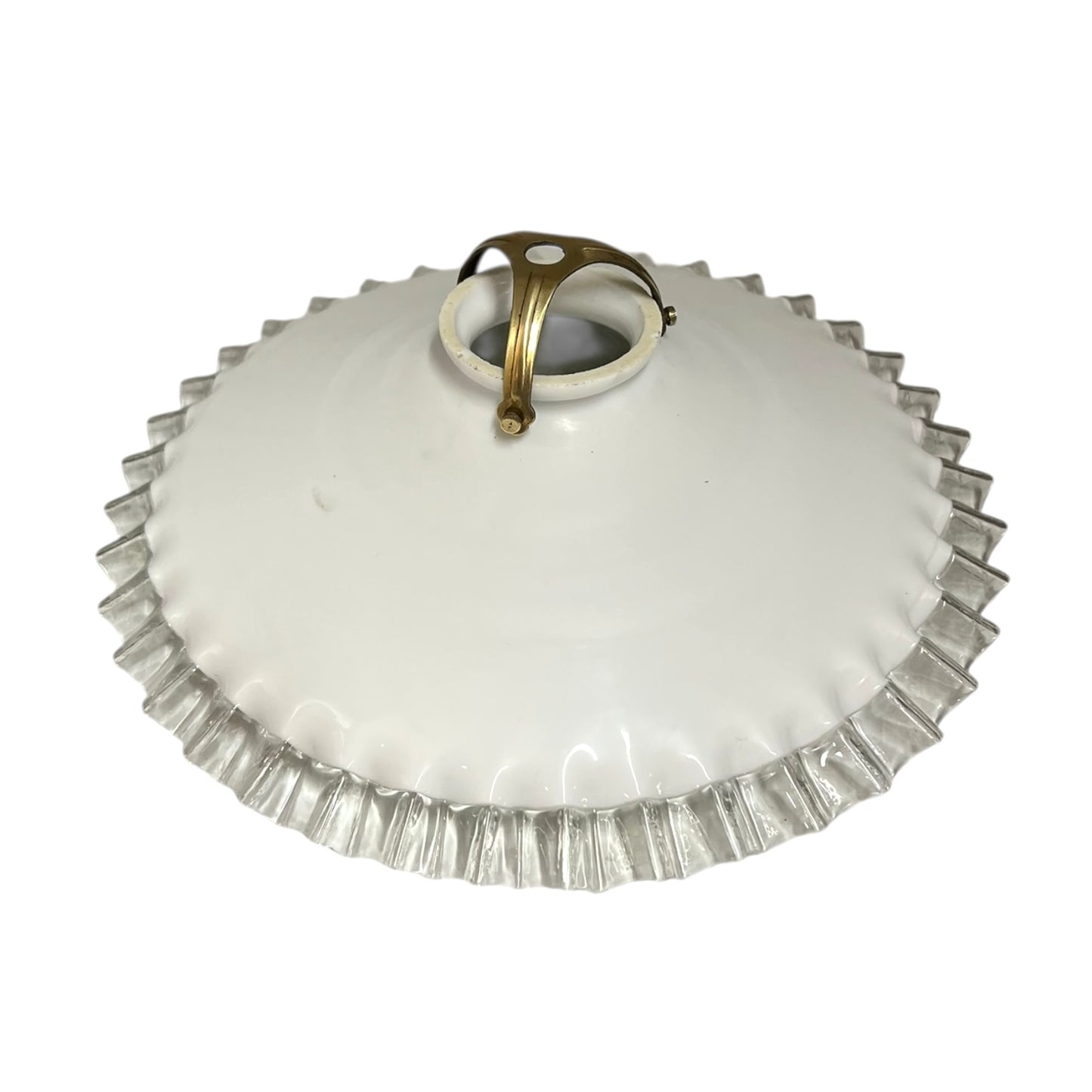 White glass lamp shade with a brass fitting on a white background