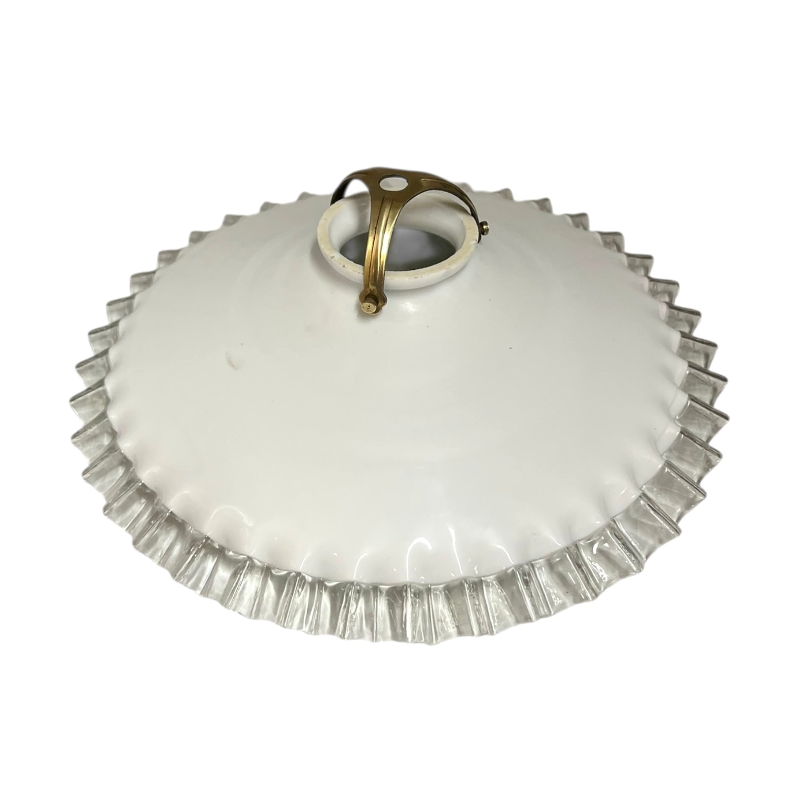 White glass lamp shade with a brass fitting on a white background