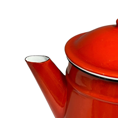 Close-up of a red teapot on a white background