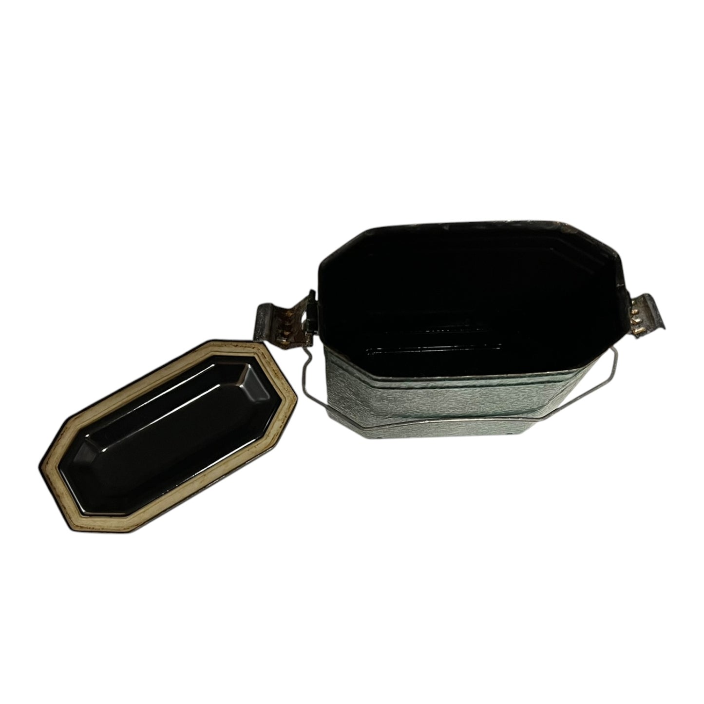 Close up of a French enamel lunch box on a white background