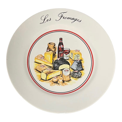 Decorative plate with illustrations of cheeses and wine, labeled 'Les Fromages'.