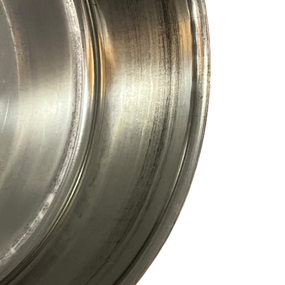 inside of copper pan with tin lining on a white background