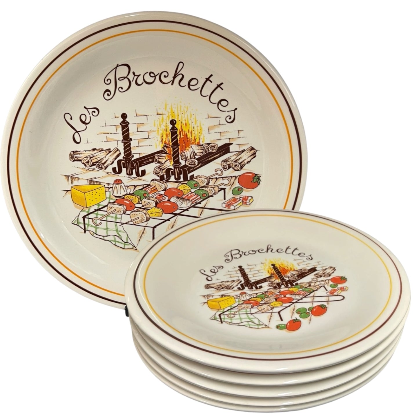 Set of ceramic plates with 'Les Brochettes' design on a white background