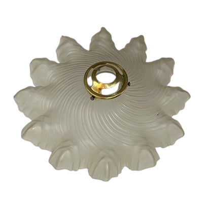 Close up of a vintage-style light fixture with frosted glass shade on a white background
