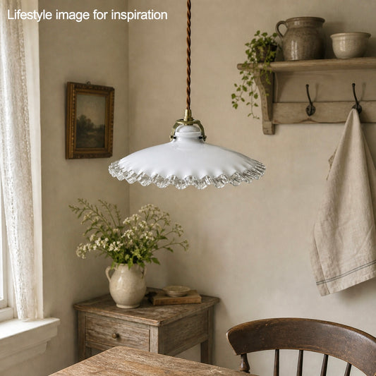 French vintage milk glass pie crust  lampshade pendant light in a rustic kitchen setting with wooden furniture and decor.