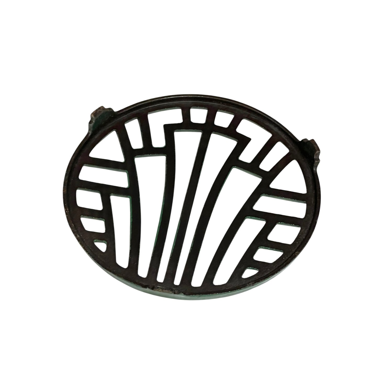 Close up of a green vintage French cast iron enamelled pan trivet on a white background
