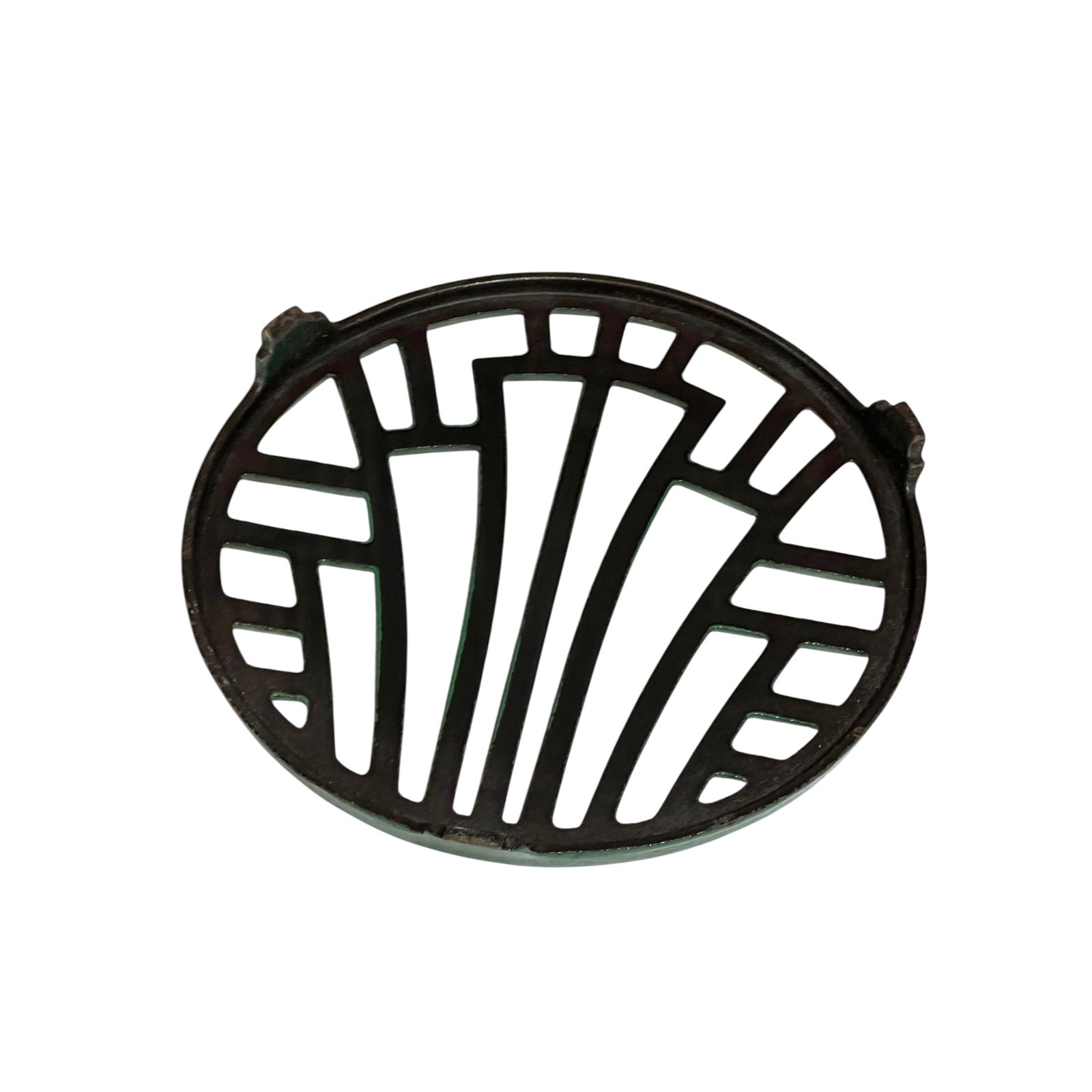 Close up of a green vintage French cast iron enamelled pan trivet on a white background