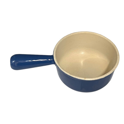 Blue saucepan with beige interior on a white background