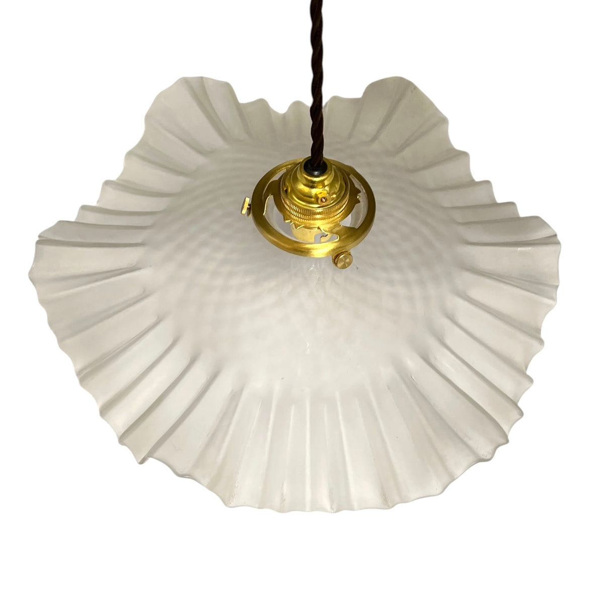 A vintage-style pendant light with a large, scalloped white glass shade and a polished gold brass fixture, suspended by a black cord against a plain white background.
