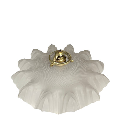 glass lampshade and brass fittings on a white background