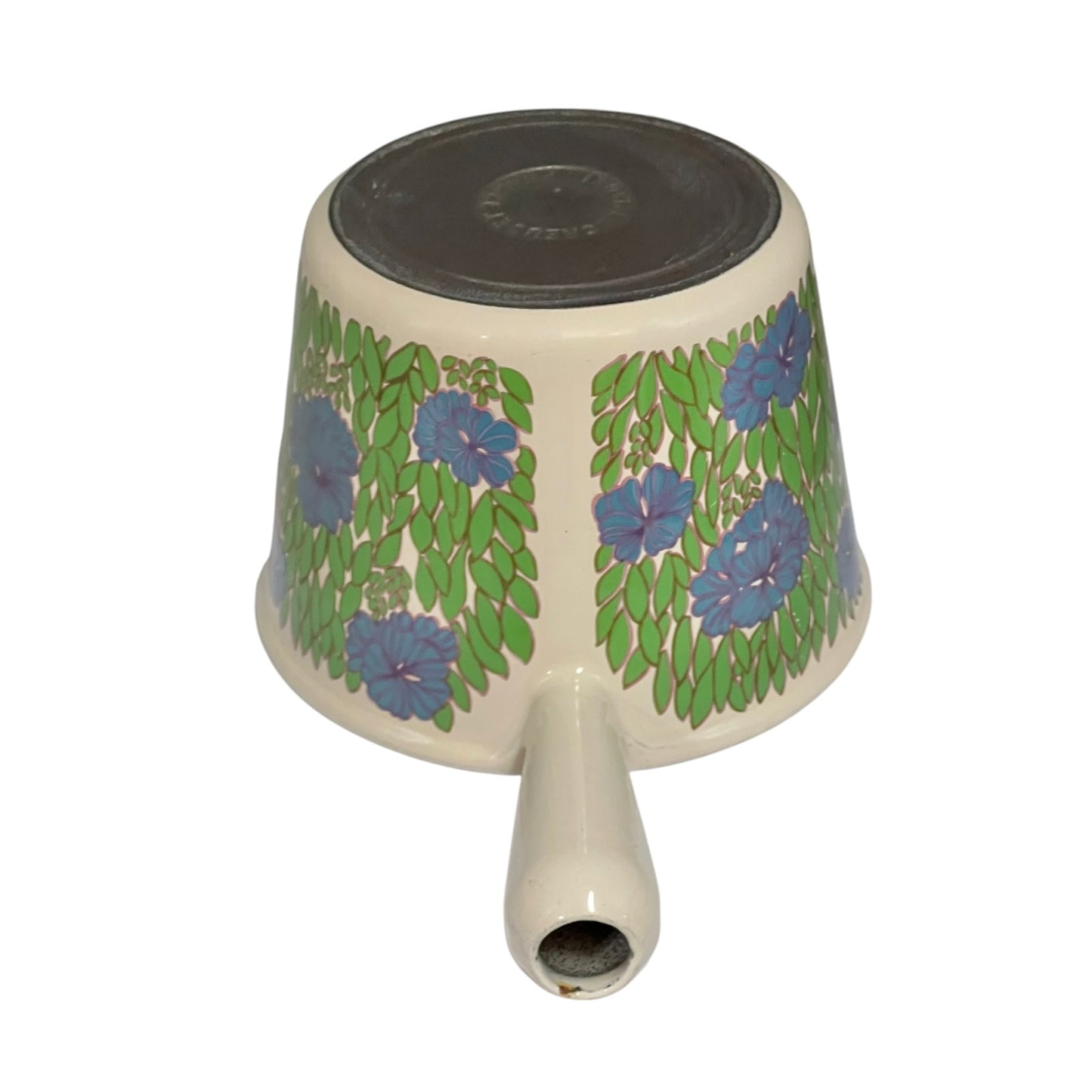 Top view of a vintage Le Creuset saucepan with a green leaves and blue flowers pattern on a white background 