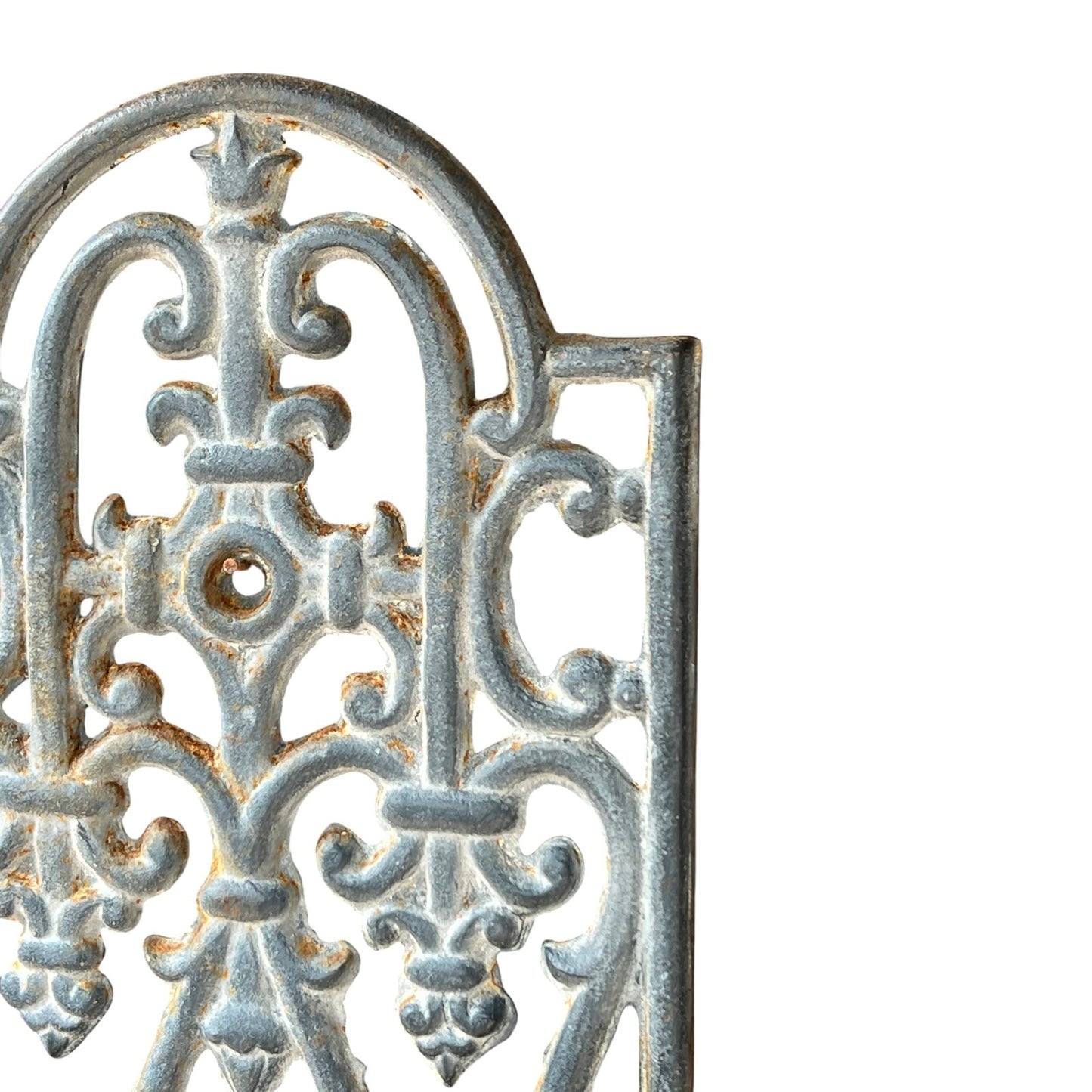 close up of a metal decorative wall planter on a white background