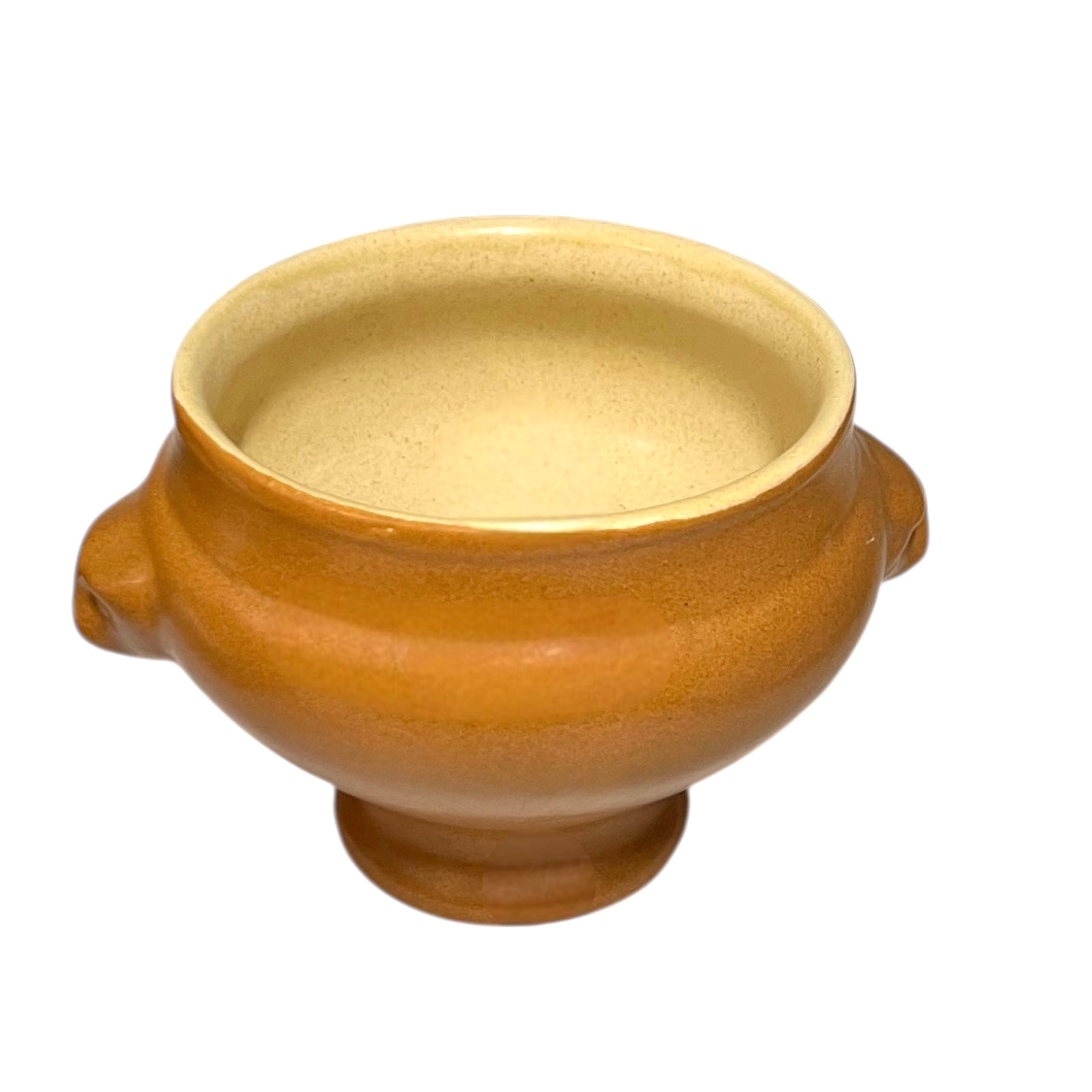 light brown ceramic French soup bowl with lions head handles on a white background 