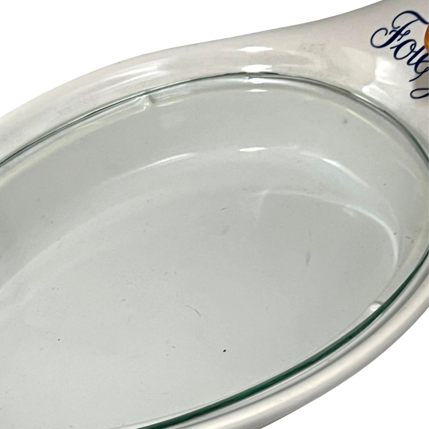 Clear glass lid with a white rim on a white background