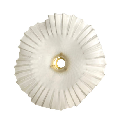 A frosted ribbed glass shade or diffuser with a scalloped outer edge and a central mounting hole, shown against a plain white background.