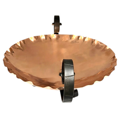 Copper fruit bowl with metal stand on a white background