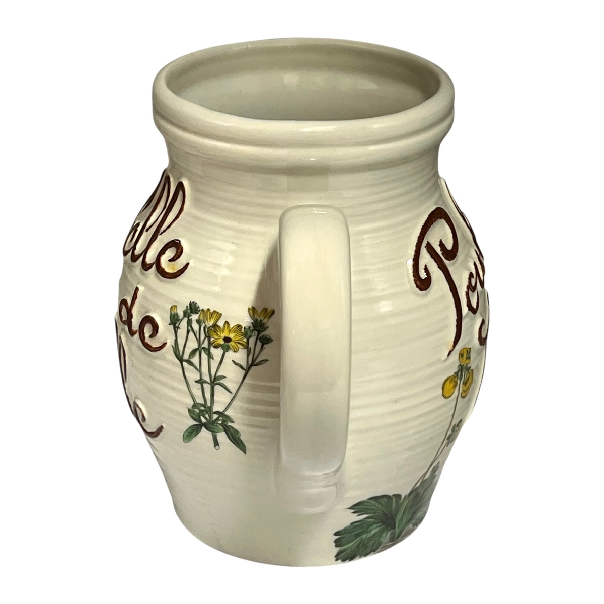 An off-white ceramic mug with a ribbed texture, featuring brown cursive text and painted yellow flowers with green leaves on the side, set against a plain white background.